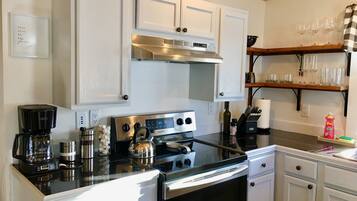 Dishwasher, coffee/tea maker, cookware/dishes/utensils