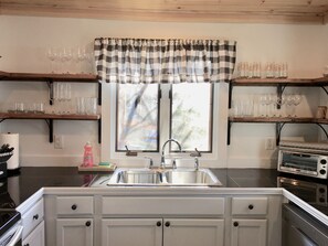 Dishwasher, coffee/tea maker, cookware/dishes/utensils