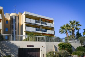 A multi-story building with balconies, a garage, and a sign reading "Le Jean-Baptiste". - LOVELY STUDIO 1 ROOM- between Monaco and Menton (Roquebrune-Cap-Martin)