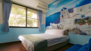A room with a bed, a window with curtains, an air conditioner, and a mural of a coastal scene. - Feng Chia Love Heart (Taichung)