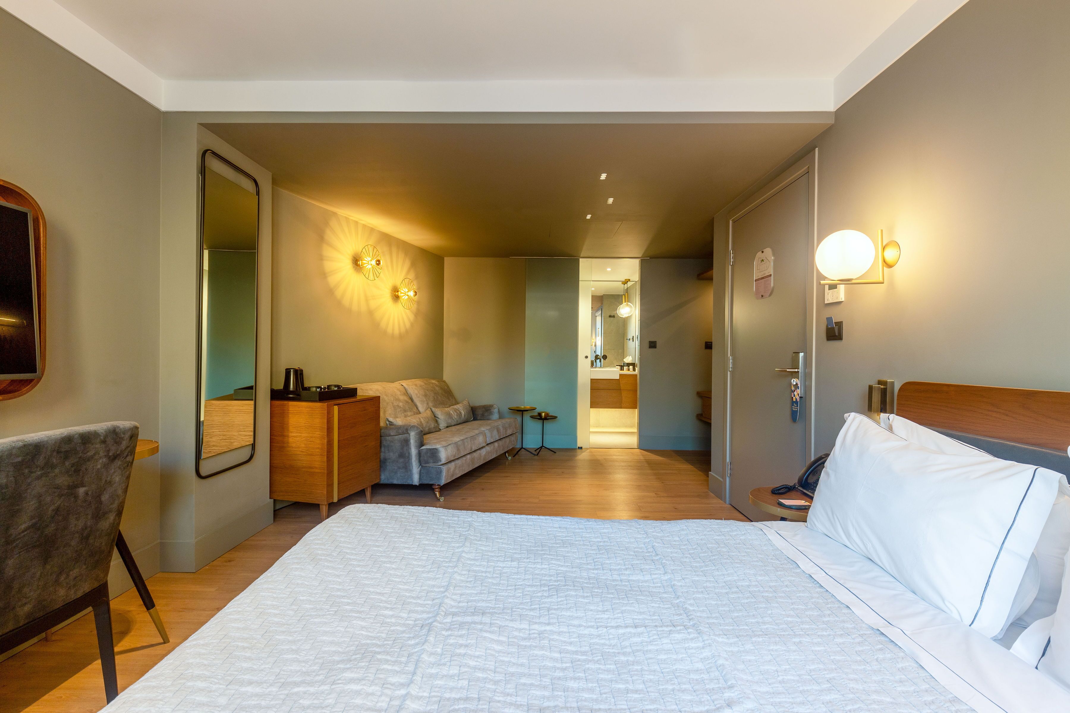 homey plus suite with balcony | desk, laptop workspace, blackout curtains, iron/ironing board