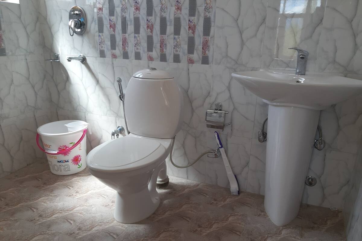 Shower, designer toiletries, hair dryer, bathrobes