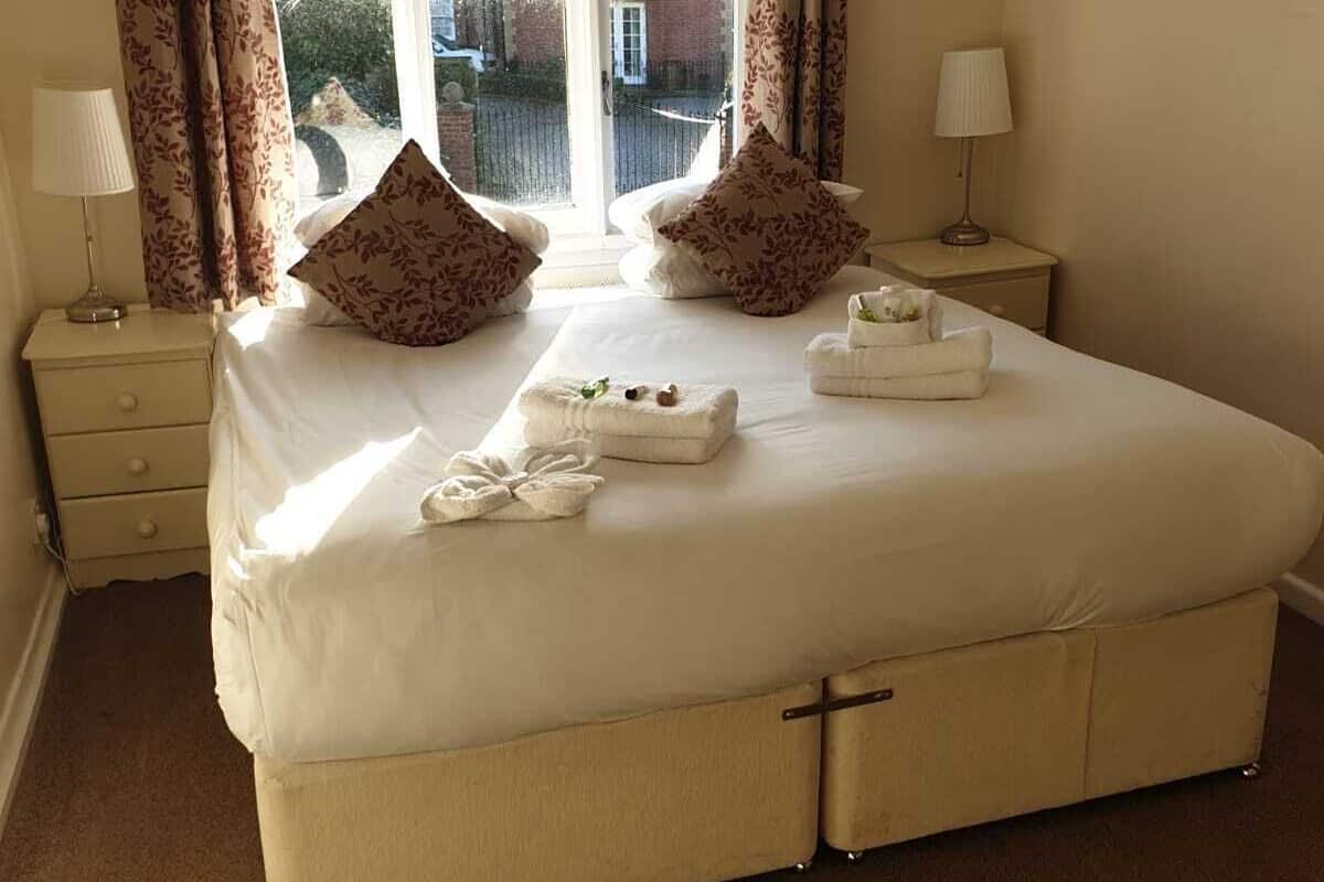 Double or Twin Room | Blackout drapes, iron/ironing board, WiFi (free), individually decorated