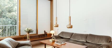 Classic Apartment, 3 Bedrooms | Living room | Flat-screen TV