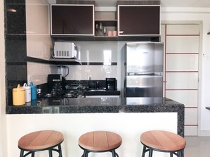 Fridge, microwave, stovetop, coffee/tea maker