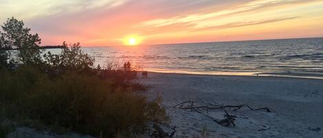 On the beach, sun-loungers, beach towels