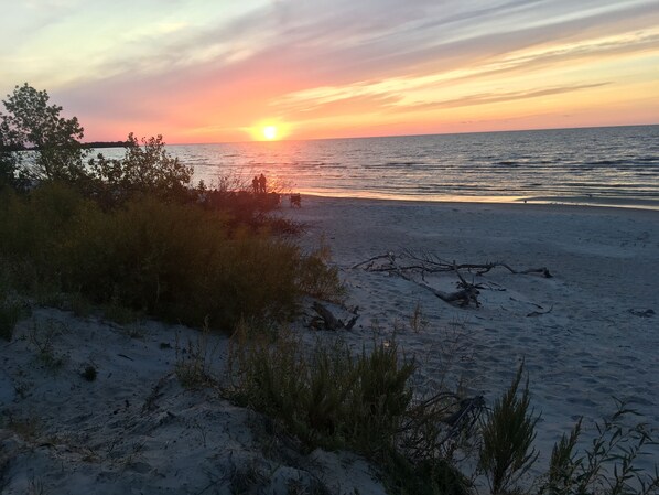 On the beach, sun loungers, beach towels