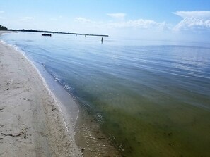 On the beach, sun loungers, beach towels
