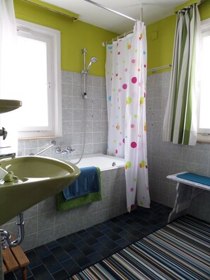 Bathtub, hair dryer, towels, soap