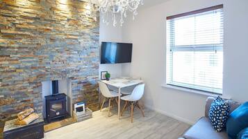 Luxury Apartment, Multiple Beds, Non Smoking, Beach View | Living area | Flat-screen TV