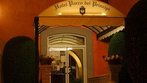The entrance to Hotel Palazzo dei Principi with a classic arched doorway and a sign above. - Hotel Parco dei Principi (Anzio)