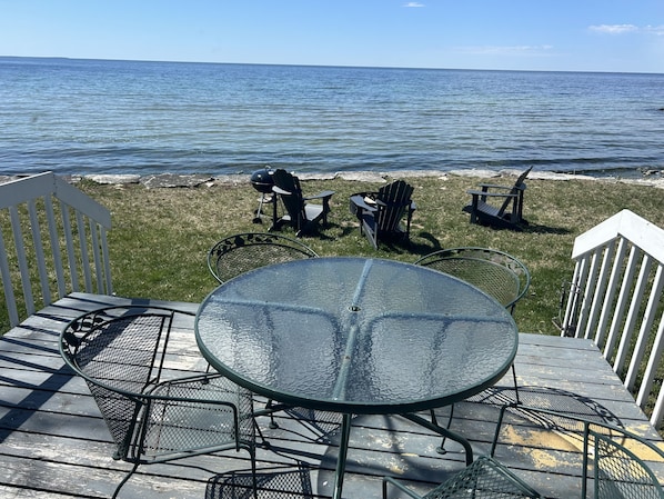 Relax on the deck overlooking the water, where you can enjoy a meal or socialize with friends.