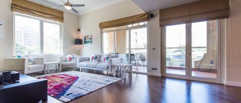 Apartment, 3 Bedrooms | Living room | Flat-screen TV