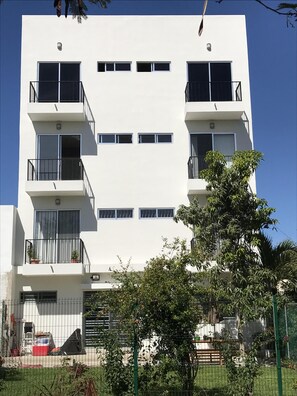 Stylish residential building with a clean, white facade and contemporary design.