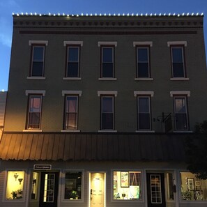 Stylish building with a storefront and residential units above.