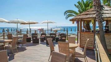 On the beach, sun-loungers, beach umbrellas