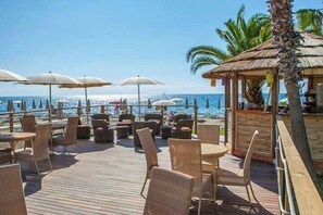 On the beach, sun-loungers, beach umbrellas