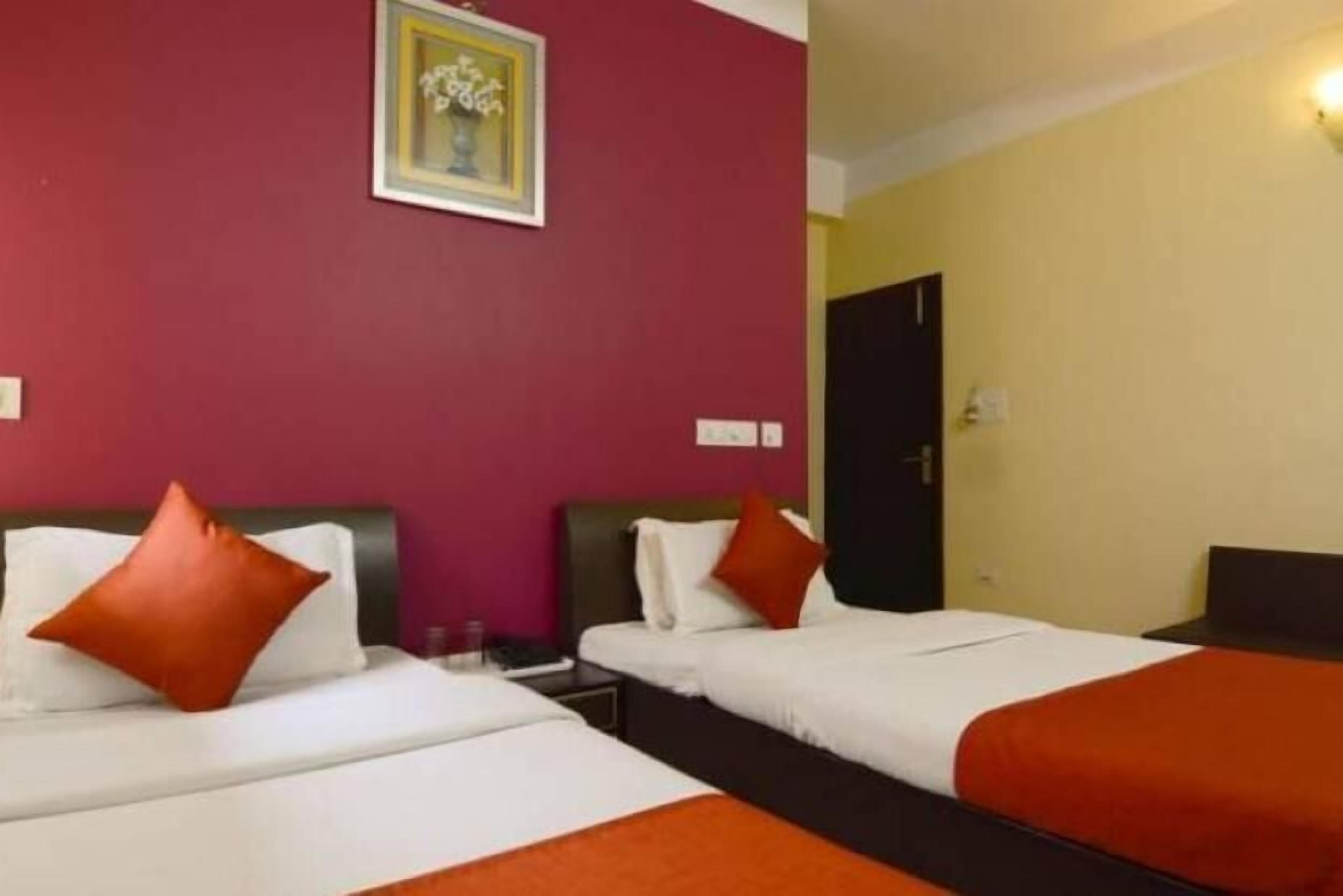 luxury double room, multiple beds, non smoking, city view | in-room safe, desk, iron/ironing board, rollaway beds