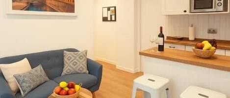 Apartment, City View | Living area | Flat-screen TV