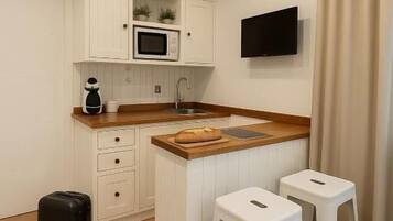 Apartment, City View | Private kitchen | Coffee/tea maker
