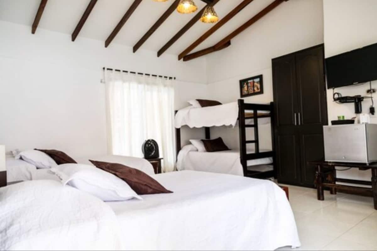 quadruple room, multiple beds, non smoking | blackout curtains, free wifi, bed sheets