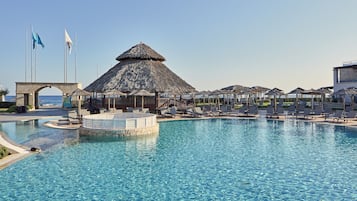 Seasonal outdoor pool, open 10:00 AM to 6:00 PM, pool umbrellas