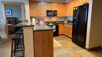 Condo (ME301) | Private kitchen | Fridge, microwave, oven, stovetop