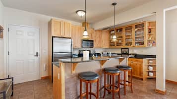 Condo (BD2A) | Private kitchen | Fridge, coffee/tea maker, cookware/dishes/utensils, dining tables
