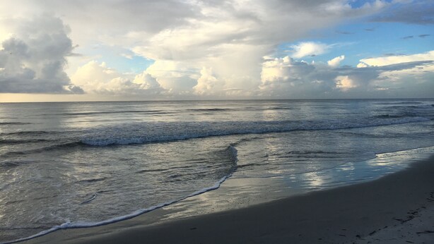 A beach with waves and a cloudy sky. - Very Desirable 1st Floor Villa at Fiddler's Cove Beach & Racquet Club (Hilton Head Island)