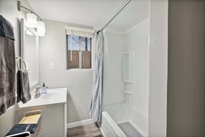 Shower, hair dryer, towels, shampoo