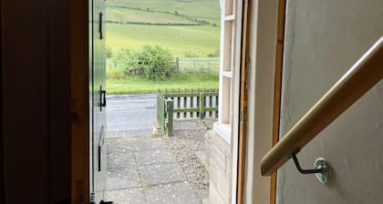 Lovely quiet cottage overlooking the Cheviot Hills, real fire, private gardens