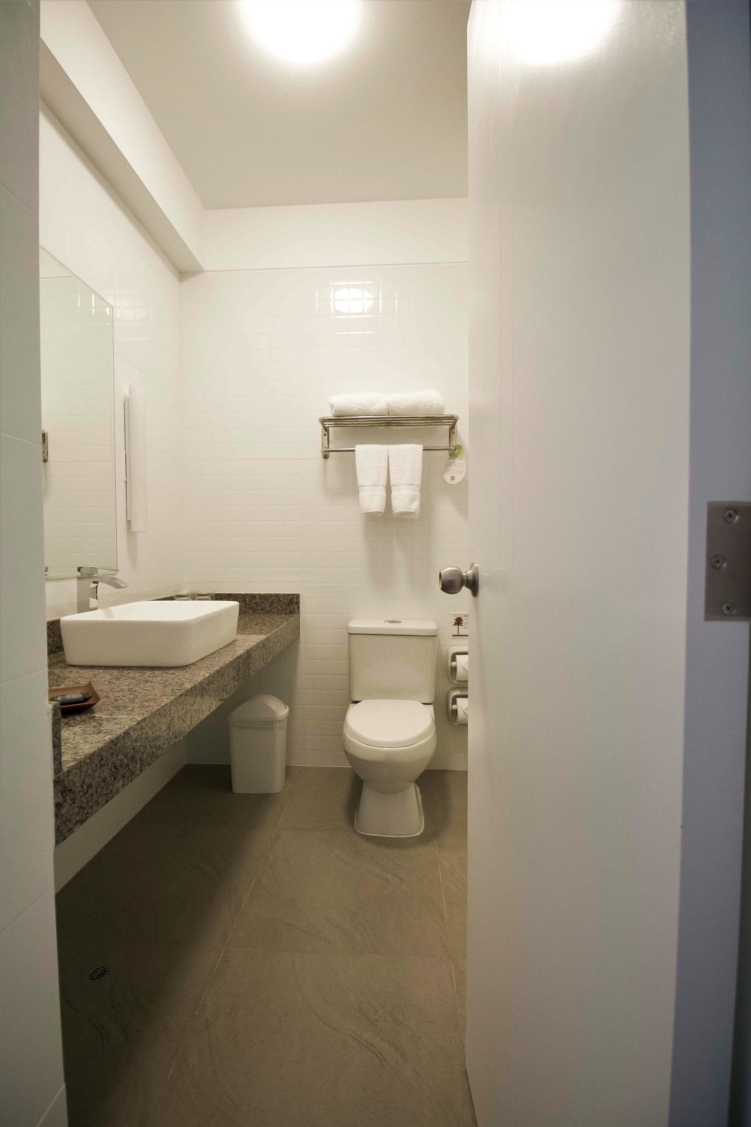 shower, rainfall showerhead, hair dryer, towels