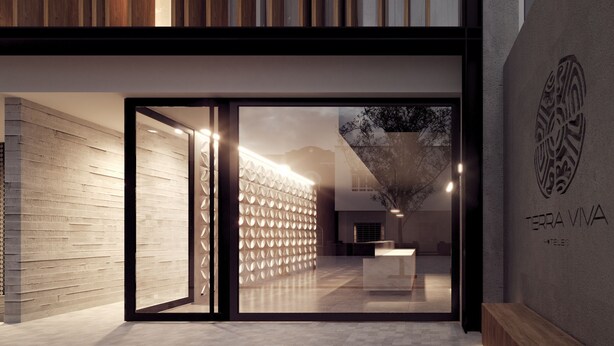 Un hall d'hôtel moderne avec un décor de panneaux en bois, un comptoir d'accueil et un escalier bien visible.