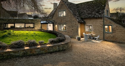 A 5* Star Award winning Cotswold Cottage dating from 1670, with Eco credentials