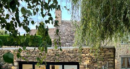 A 5* Star Award winning Cotswold Cottage dating from 1670, with Eco credentials