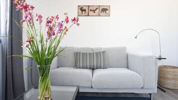 Apartment, 2 Bedrooms (Blue) | Living room | Flat-screen TV