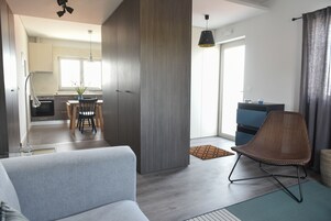 Apartment, 2 Bedrooms (Blue) | Living area | Flat-screen TV