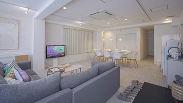 Deluxe Apartment, Non Smoking (301) | Living area | Flat-screen TV