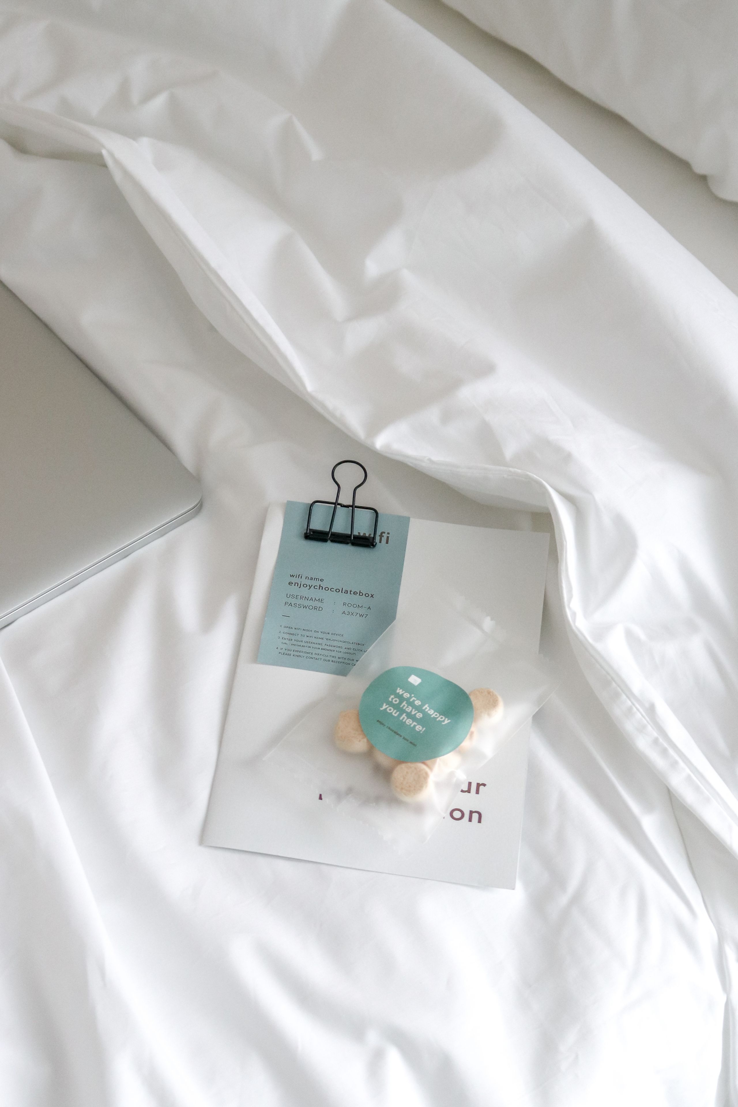 hypo-allergenic bedding, desk, laptop workspace, blackout curtains