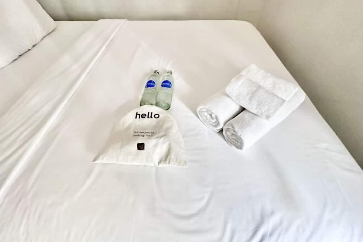 Hypo-allergenic bedding, desk, laptop workspace, blackout curtains