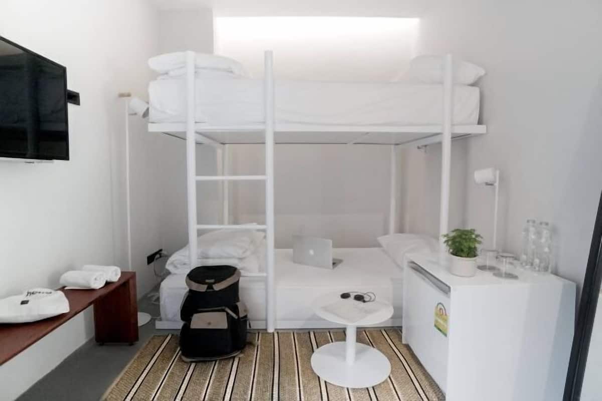 Hypo-allergenic bedding, desk, laptop workspace, blackout curtains