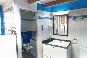 Bathtub, hair dryer, towels, soap