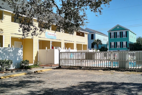 Well maintained, small building with a pool