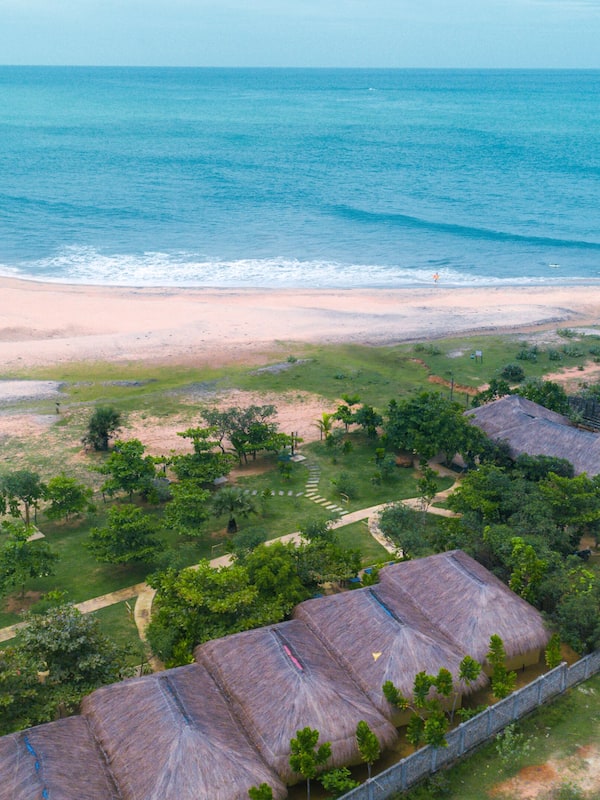 Guests can enjoy access to the sandy beach and ocean views from this coastal property.