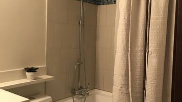 Combined shower/tub, hair dryer, towels, toilet paper