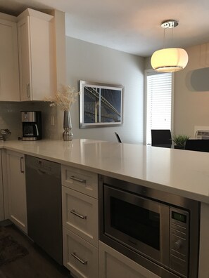 Fridge, microwave, oven, stovetop - Fully Renovated 2 Bed, 1 Bath Apartment near 8th Street (Saskatoon)
