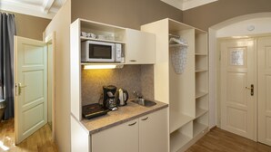 A compact kitchen with a microwave, coffee maker, and sink. - OLD TOWN - STUDIO MICHALSKA max 4 pers (Prague 1)