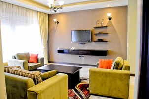 Family Apartment, 2 Bedrooms, Accessible, Hill View | Living area | Flat-screen TV