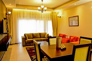 Family Apartment, 2 Bedrooms, Accessible, Hill View | Living area | Flat-screen TV