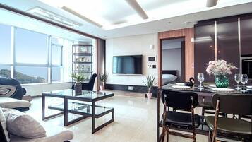 Luxury Triple Room, 3 Bedrooms, Non Smoking, Ocean View (13B Type) | Living area | 55-inch flat-screen TV with cable channels, TV